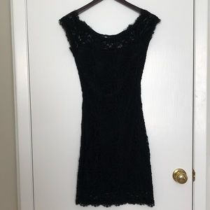 Beautiful, sexy, form fitting, black lace dress.